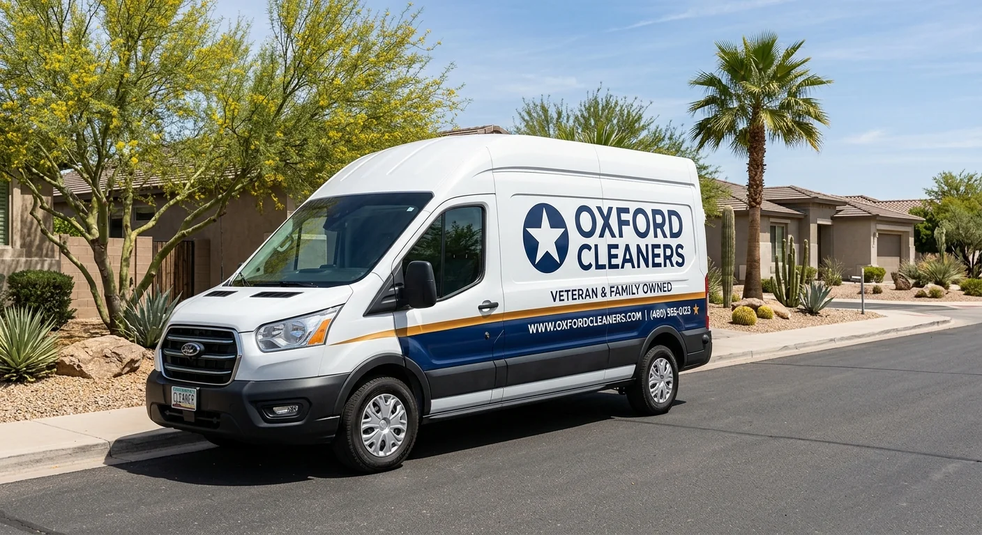 Oxford Cleaners branded navy and amber delivery van